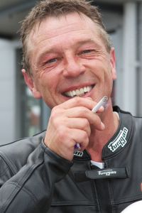Lit Up: Andy after a ride on a TZ 350 Yamaha at Donington Park in August 2012 (Photo: John Saner)