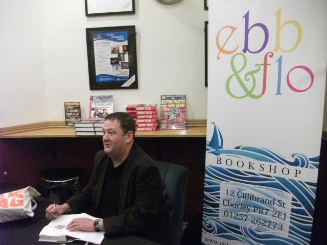 Sign On: Michael Pennington aka Johnny Vegas putting pen to paper in the bar at Chorley Little Theatre (Photo: Diane Gunning)