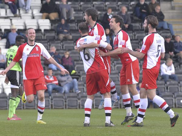 Level Pegging: Woking celebrate Brett Johnson's equaliser at the New Lawn (Photo: David Holmes)