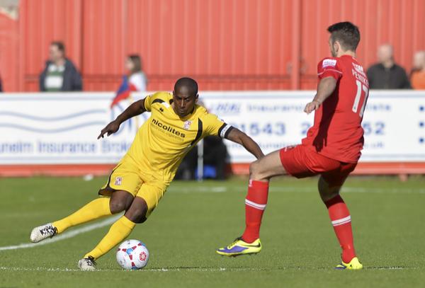 Lamb Chop: Adam Newton shows the way for Woking (Photo: David Holmes) 