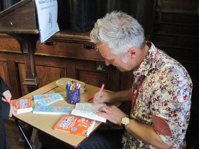 Signing On: John Dougherty  dedicates a book to a new fan (Photo: Catherine Sinclair) 