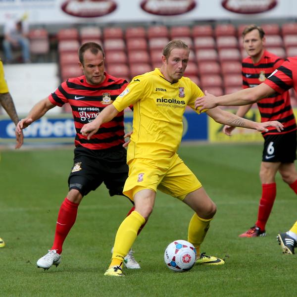Great Scott: Wrexham attempt to give Cards hot-shot Scott Rendell close supervision at the Racecourse Ground (Photo: David Holmes)