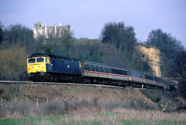 Pompey Bound: A Class 47 diesel-electric emerges from St Catherine's tunnel, Guildford, with a cross-country service from Liverpool to Portsmouth Harbour in the mid-80s, just one of many great shots featured  (Photo: Geoff Burch)