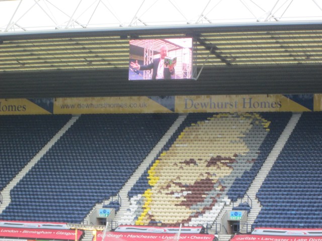 Broccoli Boy: Frank Cottrell Boyce on the Bill Shankly Kop big screen, treating the crowd to a reading  (Photo: Malcolm Wyatt)