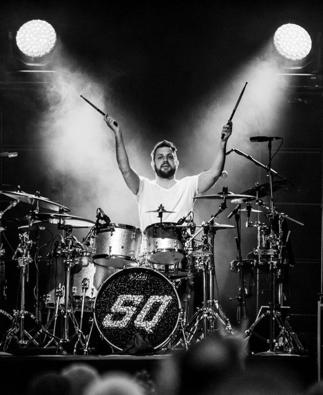 Caveman Go: Leon Cave steals the limelight while his band-mates take a nap (Photo: Symphony at the Tower/Bradley Hamer Photographic) 